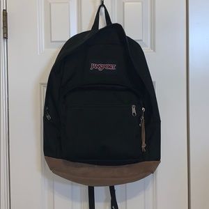 Black Jansport Right Pack Backpack. Suede bottom.